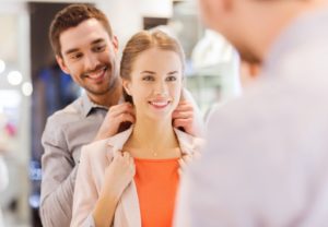 Husband giving a necklace to his wife