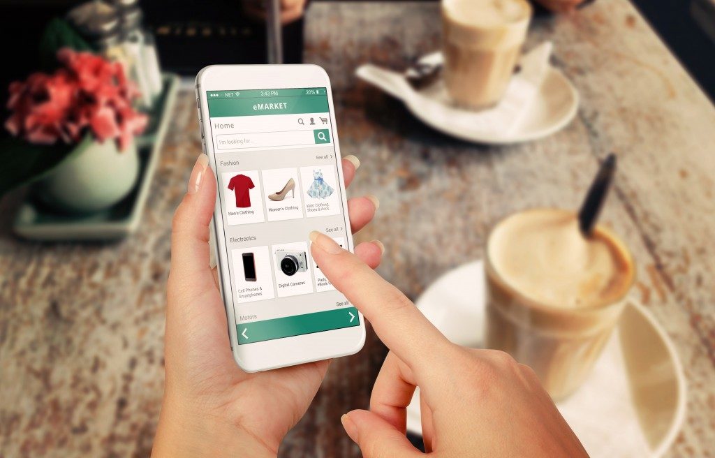 woman doing online shopping on smartphone