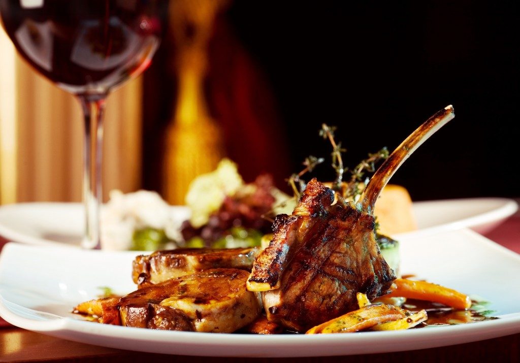 fancy dinner with wine and ribs