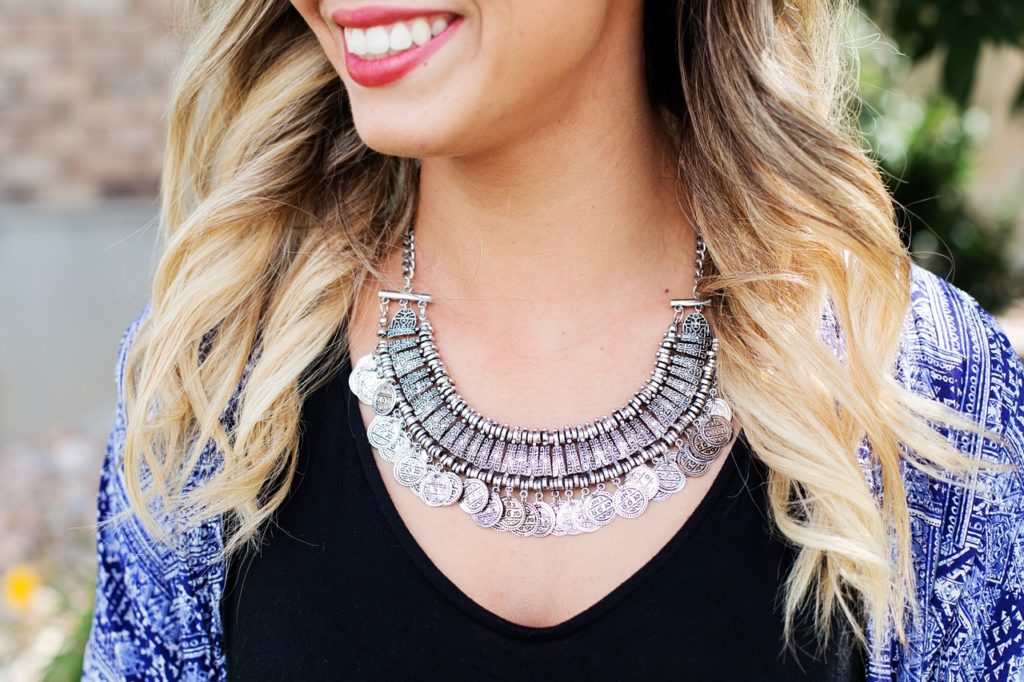 woman wearing silver necklace