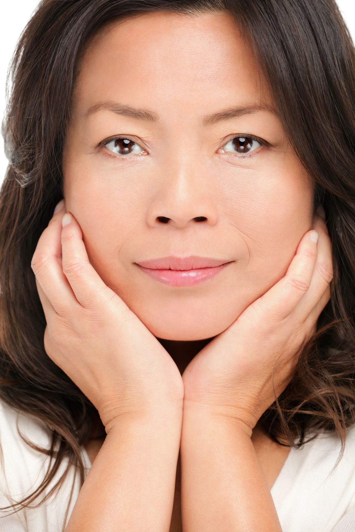mature woman holding her face
