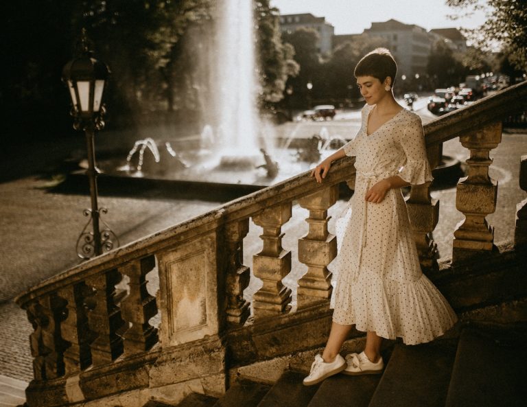 woman in a dress by the stairs