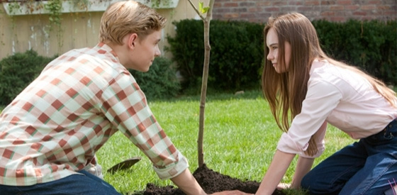 Bryce and Julie planting a tree