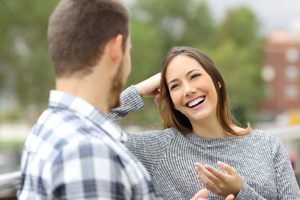 man and woman talking