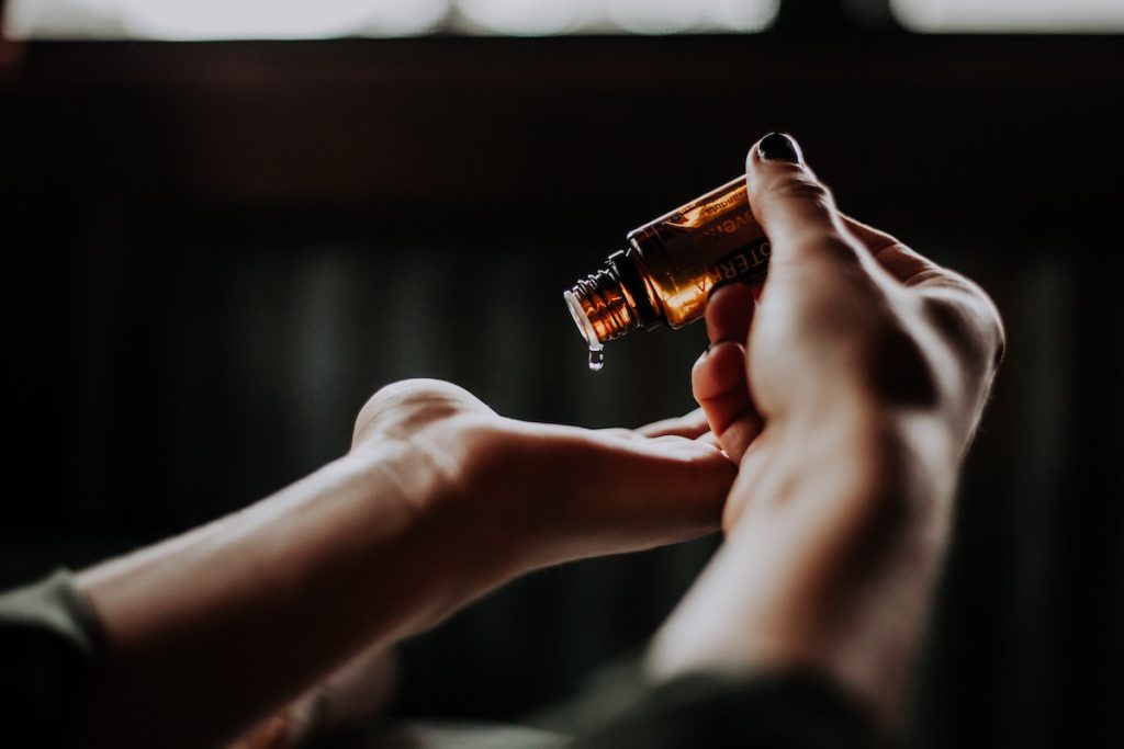 woman using essential oils