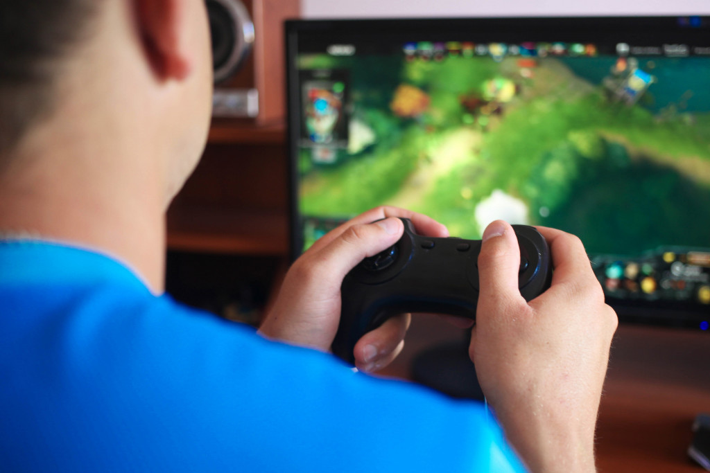 a man playing games using a gaming console