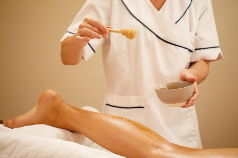 woman and waxing business employee