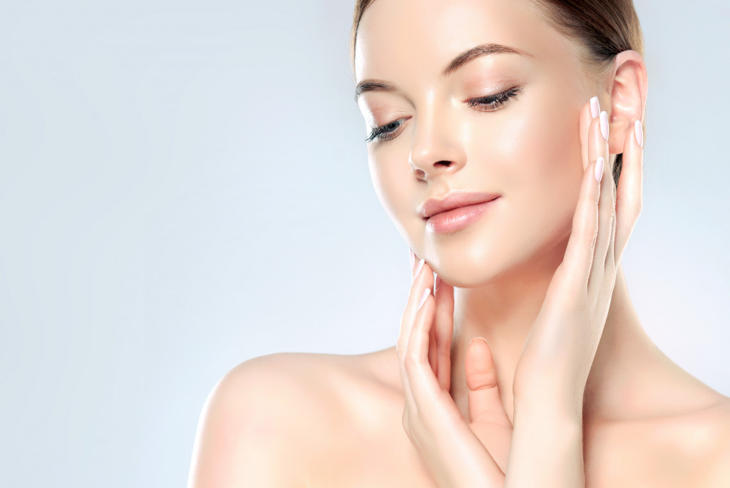 woman touching her skin