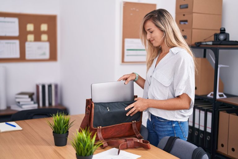 woman taking out a laptop from a bag