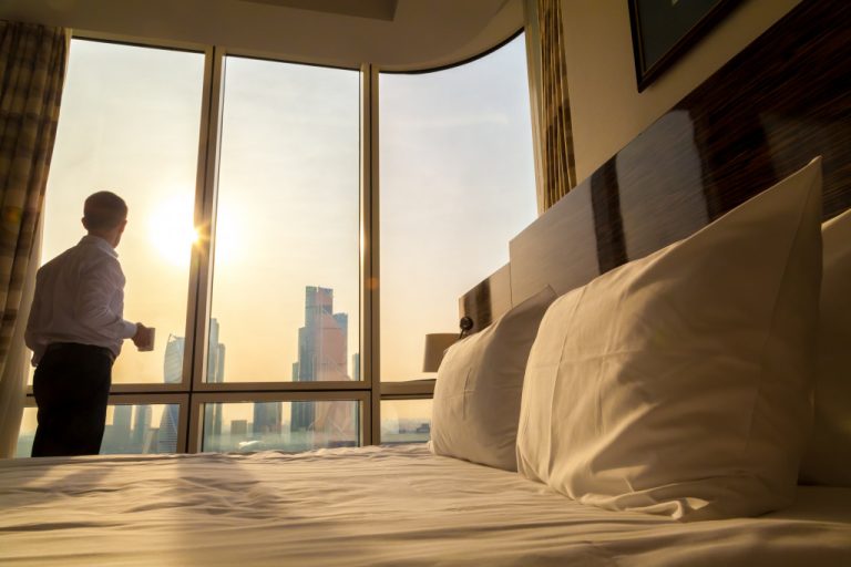 man enjoying the view from his penthouse